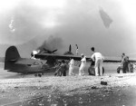 Men attempting to save a burning PBY Catalina aircraft, Naval Air Station Kaneohe, Oahu, US Territory of Hawaii, 7 Dec 1941