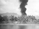 A column of smoke rising from beachhead on Leyte, Philippine Islands from American naval shelling, 20 Oct 1944