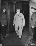 British Prime Minister Winston Churchill departing the conference room in Cecilienhof, Potsdam, Germany, 17 Jul 1945; note Soviet guards