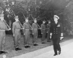 Fleet Admiral Ernest King inspecting the honor guard of British Scots Guards regiment during the Potsdam Conference, Germany, 23 Jul 1945