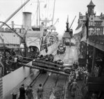 Oil being unloaded from the SS Fort Cataraqui in the Belgian port of Antwerp, 30 Nov 1944; this was the first ship to berth at the port following the opening of the Scheldt Estuary