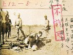 Japanese soldiers guarding a Chinese prisoner of war at bayonet point, south of Yuepu, Shanghai, China, Aug 1937; note Japanese censor