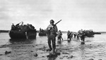 Troops of the US Army 112th Cavalry Regiment (Texas National Guard) landing at Arawe, New Britain, Bismarck Archipelago, 15 Dec 1943; note LVTs and M1 Garand rifles
