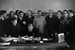 Japanese Foreign Minister Matsuoka signing the Soviet-Japanese Neutrality Pact, 13 Apr 1941, photo 1 of 3; note Molotov and Stalin in background