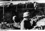 German troops in a foxhole covered by a wrecked T-34 tank, Stalingrad, Russia, 23 Sep 1942
