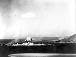 Japanese ammunition ships in Truk Harbor destroyed by dive bombers of USS Intrepid, Caroline Islands, 17 Feb 1944, photo 1 of 2; the dive bomber that caused this destruction was also lost in the blast