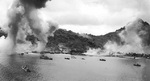Japanese naval base, warships, and fishing boats at Dublon Island under American aerial attack, Truk Atoll, Caroline Islands, 16 Feb 1944, photo 1 of 2