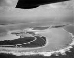 Aerial photograph of Wake taken from a PBY Catalina on 25 May 1941, looking west along the northern side, with Peale Island in the center and Wilkes Island in the left distance