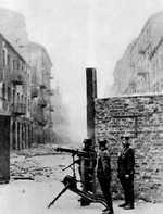 German troops with MG 08 heavy machine gun near the intersection of  Nowolipie and Smocza Streets in Warsaw, Poland during the Warsaw Ghetto Uprising, 1943