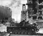 German StuG III Ausf. G assault gun fighting at the intersection of Zakroczymska and Romana Sanguszki Streets near the Polish Security Printing Works building, Warsaw, Poland, 28 Aug 1944