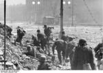 German soldiers at Theater Square during the uprising in Warsaw, Poland, 11 Sep 1944; note National Theater in background