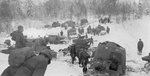Russian T-26 light tanks and T-20 Komsomolets armored tractors advancing into Finland during the Winter War, 2 Dec 1939