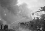Firefighters attempting to control fires caused by Soviet bombing, Finland, late 1939-early 1940