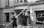 Finnish civilians escaping from a building damaged by aerial bombing, Lönnrothkatu Street, Helsinki, Finland, 30 Nov 1939