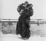 A Finnish woman in heavy fur coat watching the sky for Russian aircraft, Northern Finland, Jan 1940