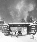 Finnish troops leaving Suojärvi, Finland, 2 Dec 1939; note smoke rising from the sabotaged equipment