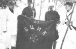 Finnish officers posing with a captured Soviet flag, Finland, 1939-1940