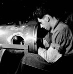Bill Potter working on a torpedo at the John Inglis fatory in Toronto, Ontario, Canada, May 1944