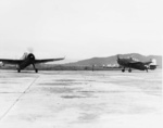 Two TBM-3 aircraft of US Navy squadron VT-26 at Matsuyama Airfield, Taihoku (now Taipei), Taiwan, early Sep 1945
