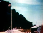 Smoke rising from burning oil storage tanks, Midway Atoll, 4 Jun 1942