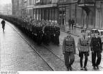 Hitler Youth members on march in a German city, en route to volunteer to join the military, 25 Nov 1944