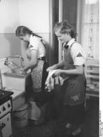 Members of the League of German Girls cleaning a shared kitchen, date unknown