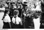 Wilhelm Frick receiving flowers from members of the League of German Girls during a visit to Bratislava, Slovakia, Sep 1941