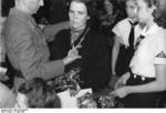 German woman being awarded the Cross of Honor of the German Mother, 17 May 1943; note League of German Girls members present