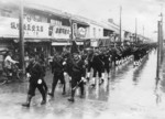 Parade of Japanese Navy personnel through a small town, Japan, circa 1930s