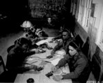 African-American US Army Air Corps Captain Roy F. Morse teaching cadets how to send and receive code, Tuskegee, Alabama, United States, Jan 1942