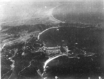 Suo (now Suao) harbor under attack by a PB4Y-1 aircraft of US Navy squadron VPB-104, eastern Taiwan, 22 Apr 1945, photo 2 of 4