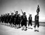 African-American US Navy Chief Steward Robert Nargrove leading his trainees on a march, Steward