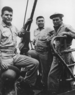 US Marine code talkers Private 1st Class Joe Hosteen Kelwood, Private Floyd Saupitty, and Private 1st Class Alex Williams aboard a transport en route to Okinawa, Japan, 1945