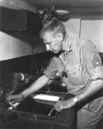US Marine photographer developing photographs, Guam, 1945