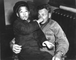 US Marine photographer William Swisher with a Chinese boy, China, 1945