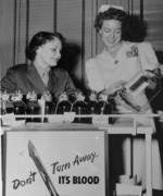 Female US Marine Sergeant Doris Hayes and nurse Alice Horton at a blood donation drive, United States, circa 1945