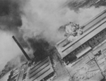 Kagi butanol plant under attack by B-25 bombers of 3rd Bombardment Group, USAAF 5th Air Force, Kagi (now Chiayi), Taiwan, 3 Apr 1945, photo 1 of 5