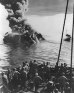 Sinking of oiler USS Mississinewa after being struck by a Kaiten in Ulithi anchorage, Caroline Islands, 20 Nov 1944; photograph taken from fleet ocean tug USS Munsee