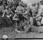US soldiers instructing Chinese soldiers on the use of a 60-mm mortar at the Kunming Infantry School, Yunnan Province, China, 23 Sep 1944