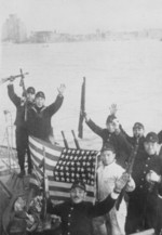 Japanese naval infantrymen aboard a ship off Shanghai, China, 8 Dec 1941; note captured American flag, M1928 Thompson submachine guns, and M1897 Winchester shotguns