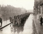 Captured German military policemen and Gestapo personnel being marched to a prisoners of war camp, Strasbourg, France, 29 Nov 1944