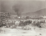 Distant view of a town being contested by defending German troops and attacking American troops, Germany, 1945