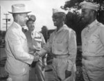 US Under Secretary of War Robert Patterson congratulated African-American Col. Chauncey M. Hooper after an inspection, US Territory of Hawaii, Aug 1943; also: Lt Gen Robert Richardson, Col Harry Reube