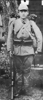 A typical Japanese soldier with Type 99 7.7mm rifle, ammunition pouches, and pack; location and date unknown