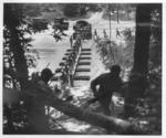 Japanese-American troops of US 442nd Regimental Combat Team building and crossing a pontoon bridge during training at Camp Shelby, Hattiesburg, Mississippi, United States, Jul 1943