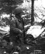 Japanese-American of Company F, US 442nd Regimental Combat Team standing on guard, France, Nov 1944