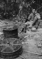 Chinese soldier speaking on a field telephone, Burma or Southern China, circa mid-1940s