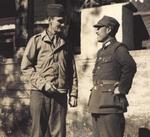 Chinese and American officers in conversation, China, date unknown