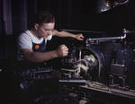A worker of the North American Aviation factory in Inglewood, California, United States machining an aircraft part, 1942