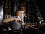 A female North American Aviation employee working on a section of the leading edge of an aircraft horizontal stabilizer, Inglewood, California, United States, Oct 1942